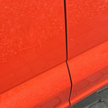 Dent Affect-Paintless Dent Repair - This was a door dent from a car door park next to our car that opened into it. A little hard to see but it's a crease In the door. - Mobile Dent Repair Near Me
