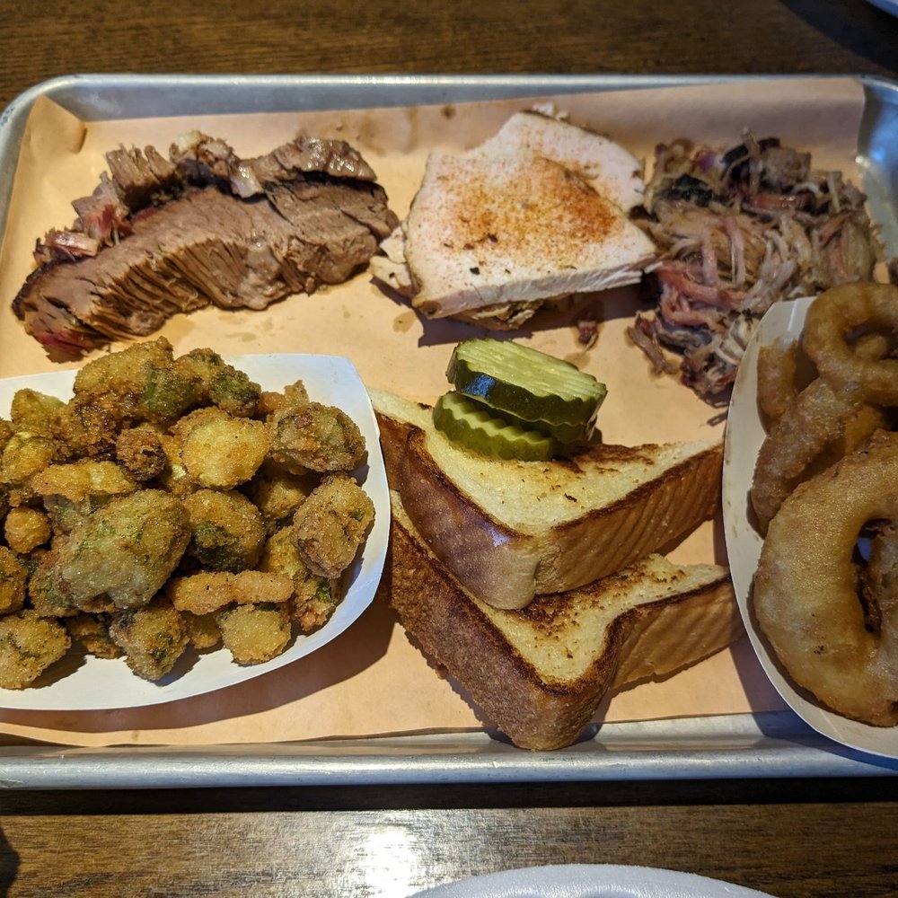 Pit Master plate with brisket, sliced turkey & pulled pork plus fried okra & onion rings ($1 more). Pit Master plate with brisket, sliced turkey & pulled pork plus fried okra & onion rings ($1 more).