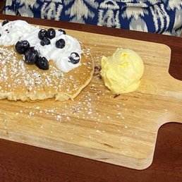 Blueberry pancakes on wood. Blueberry pancakes on wood.