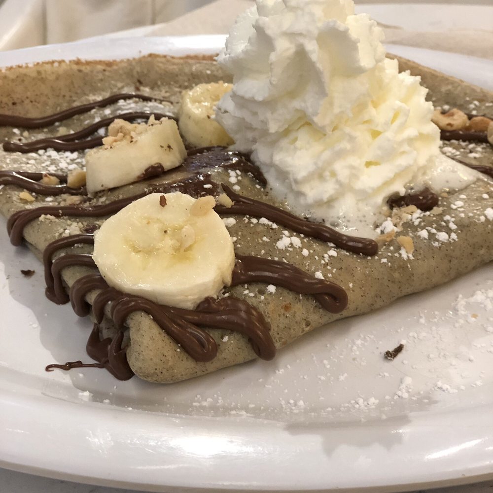 Nutella Cafe - Buckwheat crepe with banana, whipped cream and hazelnut. - Desserts Near Me - Chicago, Illinois Nutella Cafe - Buckwheat crepe with banana, whipped cream and hazelnut. - Desserts Near Me - Chicago, Illinois