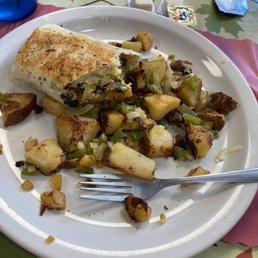Egg cheese bacon spinach tomato wrap on home fries