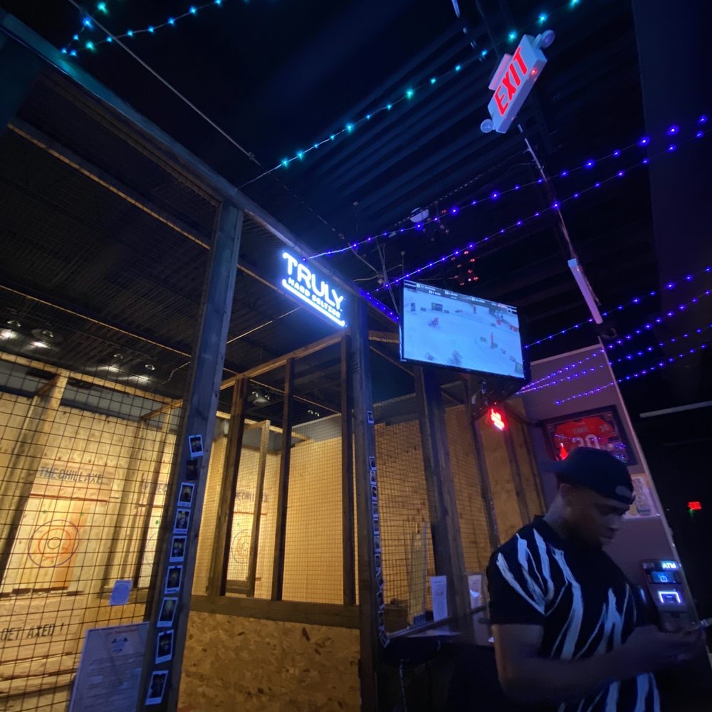 The Chill'Axe Throwing - a man sitting at a bar - Axe Throwing Near Me - Aurora, Illinois The Chill'Axe Throwing - a man sitting at a bar - Axe Throwing Near Me - Aurora, Illinois