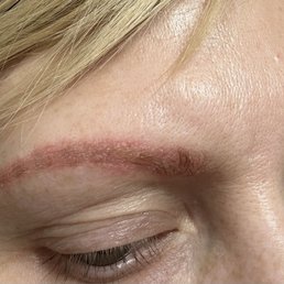 Eyebrows after getting a service done tattooed.
