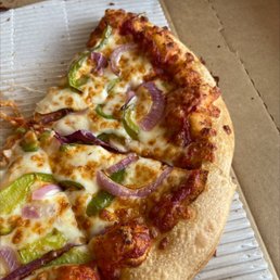 Pizza with onions and green peppers.