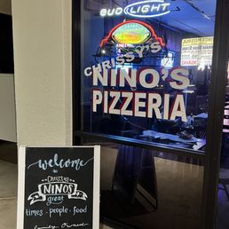 a sign in front of a restaurant a sign in front of a restaurant