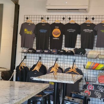 Contrast Artisan Ales - a wall of t - shirts - Brewpubs Near Me - Chamblee, Georgia