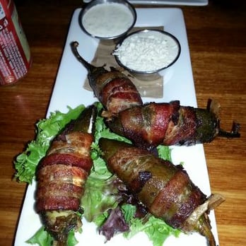 Waterloo - Jalapeno Poppers stuffed with cream cheese and wrapped in bacon - served with blue cheese and ranch - Burgers Near Me - Louisville, Colorado Waterloo - Jalapeno Poppers stuffed with cream cheese and wrapped in bacon - served with blue cheese and ranch - Burgers Near Me - Louisville, Colorado