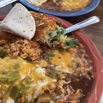 MartAnne's - Red plate - breakfast chilaquiles with green chili pork Blue plate - Pablo's Last Meal (chicken enchilada) - Breakfast & Brunch Near Me - Flagstaff, Arizona