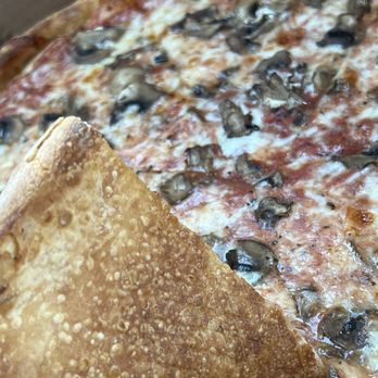 Rustica Pizzeria - nice and crispy bubbles on the bottom of a mushroom pizza - Pizza Near Me - Las Vegas, Nevada Rustica Pizzeria - nice and crispy bubbles on the bottom of a mushroom pizza - Pizza Near Me - Las Vegas, Nevada