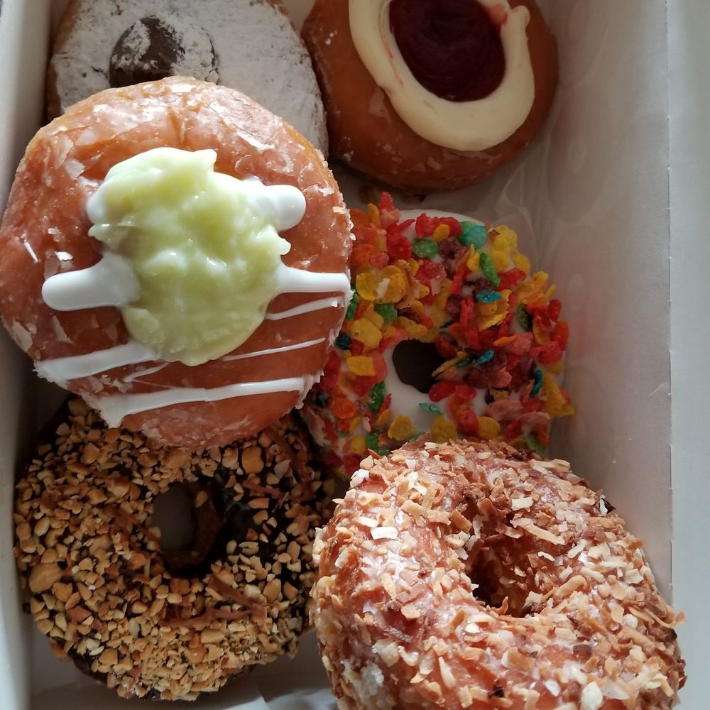 Donuts To Go - Top to bottom: Nutella, Key Lime, Snickers, Strawberry Cheesecake, Fruity Pebbles and Crunchy Coconut - Donuts Near Me - Sanford, Florida Donuts To Go - Top to bottom: Nutella, Key Lime, Snickers, Strawberry Cheesecake, Fruity Pebbles and Crunchy Coconut - Donuts Near Me - Sanford, Florida
