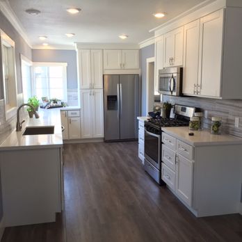 H&L Home Supply - a kitchen with white cabinets and stainless steel appliances - General Contractors Near Me H&L Home Supply - a kitchen with white cabinets and stainless steel appliances - General Contractors Near Me