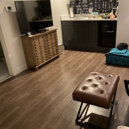 I used the little footrest as a sort of table. Tons of room for an actual coffee table I used the little footrest as a sort of table. Tons of room for an actual coffee table