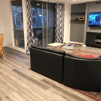 Forever Builders - Living and dining area after.  New floors and paint and added shelving. - General Contractors Near Me - San Diego, California