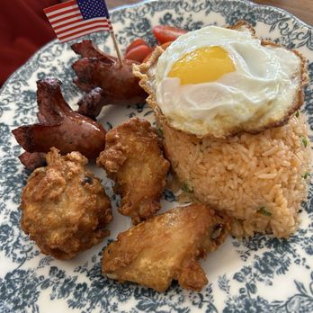 Peak - Uncle Sam's Fried Rice is tomato rice with pea & carrots, "octopus-style" hot dogs, fried chicken wings, and a fried egg...satisfying! - Thai Near Me - Alameda, California