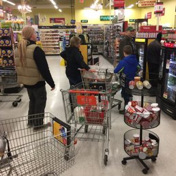 people shopping in a grocery store