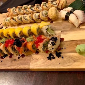 Sushi Zen - 2 MSU rolls, Mango Roll, (unsure what the name of the sushi is in the front with fish eggs) 2 octopus nigiri(sushi). - Sushi Bars Near Me - Brighton, Michigan Sushi Zen - 2 MSU rolls, Mango Roll, (unsure what the name of the sushi is in the front with fish eggs) 2 octopus nigiri(sushi). - Sushi Bars Near Me - Brighton, Michigan