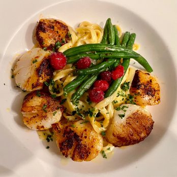 The White Dog Bistro - Braised scallops over fettuccine. - American Near Me - Mathews, Virginia The White Dog Bistro - Braised scallops over fettuccine. - American Near Me - Mathews, Virginia