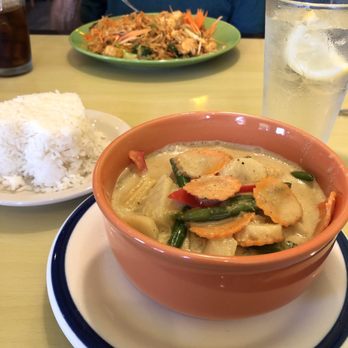Jit's Thai Bistro - Yellow Curry with veggies and steamed rice in the foreground, Pad Thai in background - Thai Near Me - Spencer, Indiana Jit's Thai Bistro - Yellow Curry with veggies and steamed rice in the foreground, Pad Thai in background - Thai Near Me - Spencer, Indiana