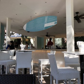 Chiki - a view of a restaurant with tables and chairs - Bars Near Me - Palm Springs, California Chiki - a view of a restaurant with tables and chairs - Bars Near Me - Palm Springs, California
