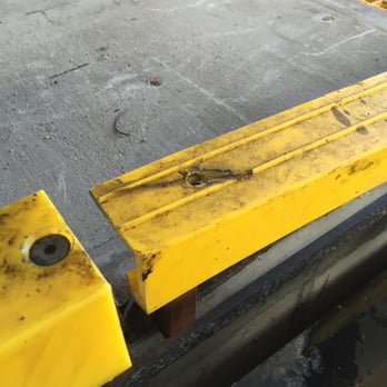 Chevron - Corner of the yellow plastic railing has clear wear and black residue from what I believe is the plastic shaved off of my side skirt. - Gas Stations Near Me - Camarillo, California