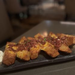 Garrison Oak Steakhouse - Loaded potato wedges