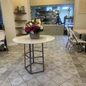 Lamalo - a table with a basket of flowers on it - Breakfast & Brunch Near Me - Los Angeles, California Lamalo - a table with a basket of flowers on it - Breakfast & Brunch Near Me - Los Angeles, California