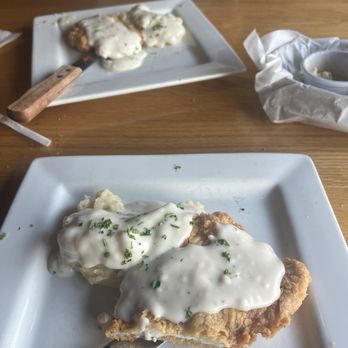 Bison Steakhouse - chicken fried chicken w/ mashed potatoes & gravy split in half - Steakhouses Near Me - Broken Arrow, Oklahoma