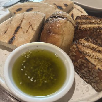 Honey & Smoke - Grilled breads with amazingly flavorful olive oil with Zatar and sesame seeds. - Middle Eastern Near Me - London, XGL Honey & Smoke - Grilled breads with amazingly flavorful olive oil with Zatar and sesame seeds. - Middle Eastern Near Me - London, XGL