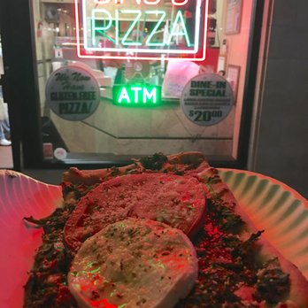 Gino's Pizzeria - a slice of pizza on a paper plate - Pizza Near Me - Patchogue, New York