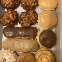 Judy's Donuts - Apple fritters, lemon filled, strawberry filled, Bavarian cream, cinnamon roll, maple bar, chocolate bar, cinnamon sugar, coconut.