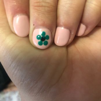 Enchanted Nail Salon - It was suppose to be a darker green in the middle and she put black and the petals are even touching. - Nail Salons Near Me - Orange, California