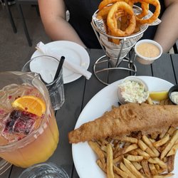 Ned Devine's Irish Pub - Left: white sangria pitcher Top: onion rings Bottom: fish and chips