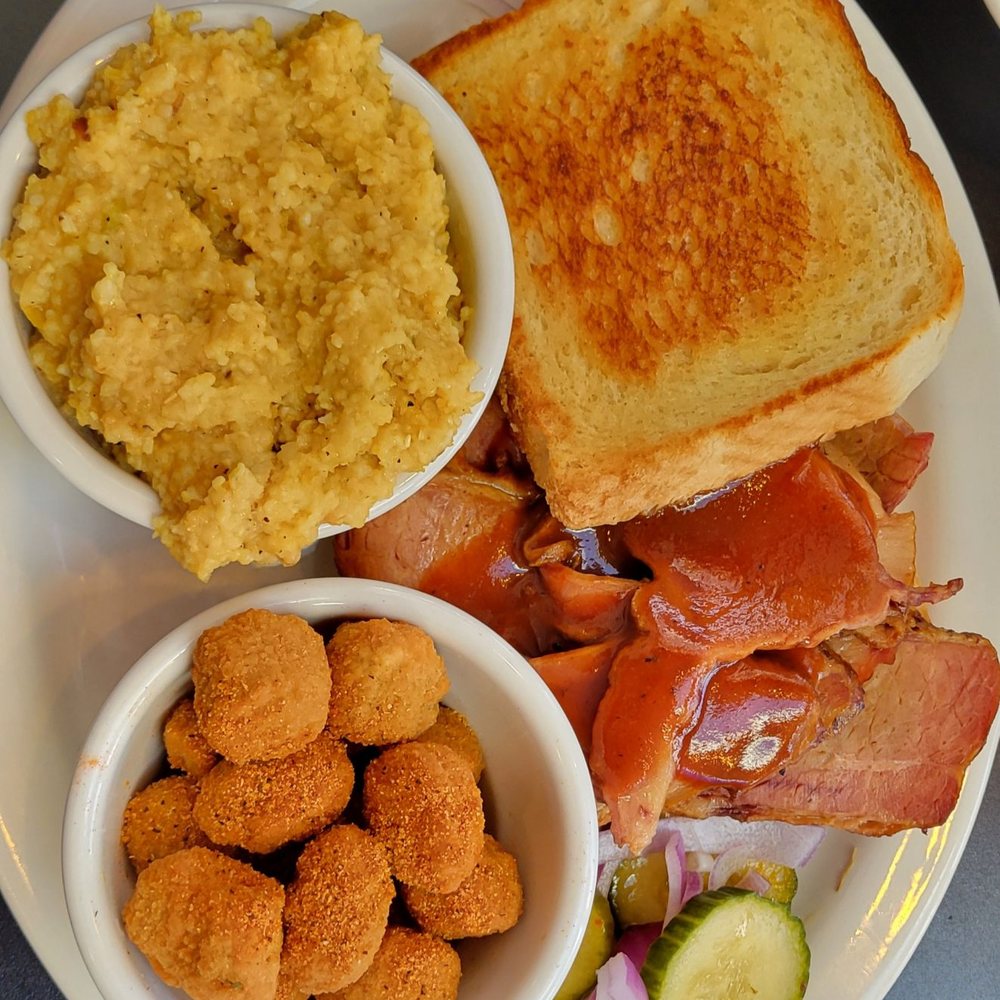 Southern Belle Diner - Brisket sandwich on Texas toast with Green Chile cheese grits & fried okra dusted with seasoning, raw onions & house-made pickles - Breakfast & Brunch Near Me - Lancaster, New York Southern Belle Diner - Brisket sandwich on Texas toast with Green Chile cheese grits & fried okra dusted with seasoning, raw onions & house-made pickles - Breakfast & Brunch Near Me - Lancaster, New York
