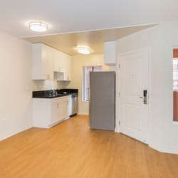 Vintage at 425 Broadway Apartments - Living Room and Kitchen