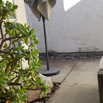 Fernando Landscaping - a patio with an umbrella - Landscaping Near Me Fernando Landscaping - a patio with an umbrella - Landscaping Near Me