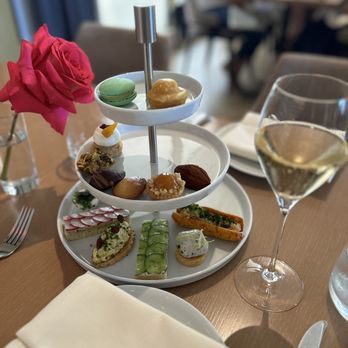 Knife Pleat - House champagne and one serving of the tea sandwiches, savory at the bottom tier and sweet for the two upper tiers. - French Near Me - Costa Mesa, California