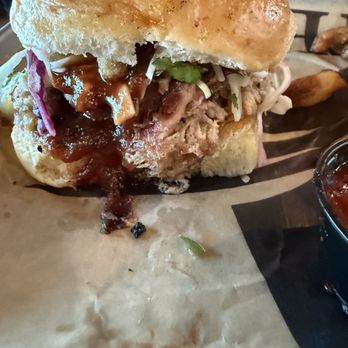 Elm Fork Taphouse & Kitchen - Hog sandwich (pulled pork, onion straws, coleslaw and pickles on a jalapeño bun. - American Near Me - Hickory Creek, Texas