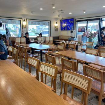 Morning Drip Cafe - Most of the tables and chairs were empty, with only a few customers seated near the windows. - Cafes Near Me - Westminster, California