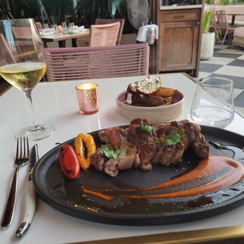 Strawberry Moon - Bone-in strip steak with steak frites - Mediterranean Near Me - Miami Beach, Florida Strawberry Moon - Bone-in strip steak with steak frites - Mediterranean Near Me - Miami Beach, Florida
