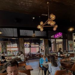 Rabun Social - Cool vibe. On the other side of the bar there are big windows that open to the outside. Outside there is seating for the bar. Very cool!