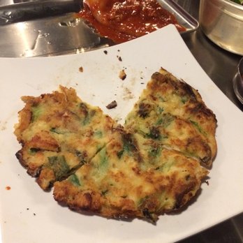 Exit 5 Korean BBQ - Seafood pancake and squid in the background! - Korean Near Me - Renton, Washington