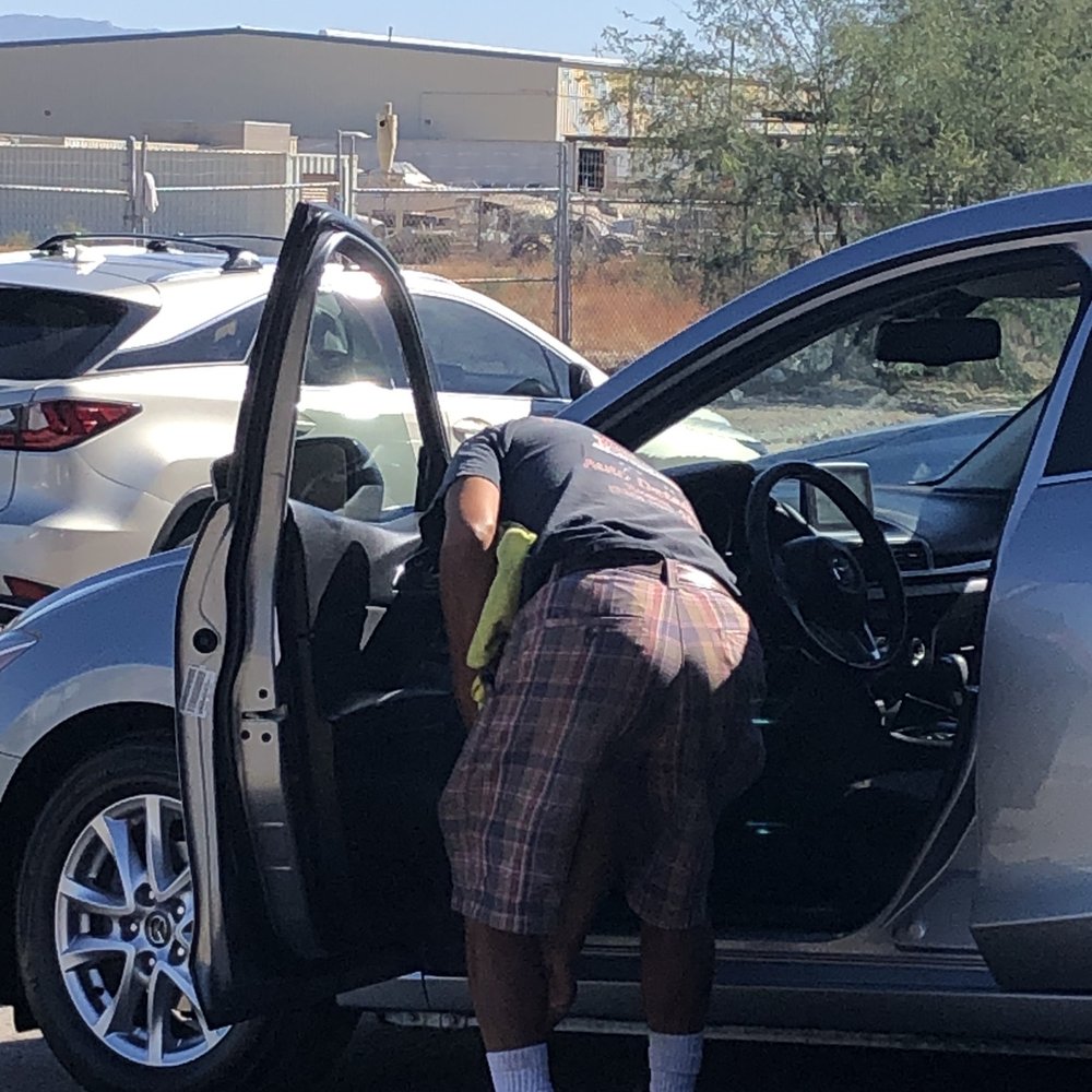 Fine Lines Auto Detailing - Finishing touch on the Car ahead of me. - Auto Detailing Near Me - Tucson, Arizona