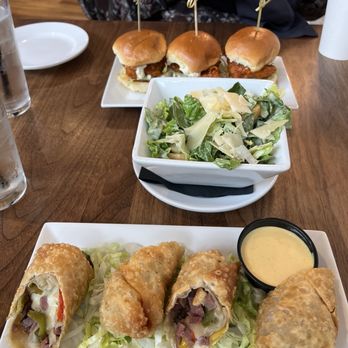 Rusk Kitchen & Bar - Buffalo chicken sliders, Caesar salad, Philly cheesesteak rolls. - Cocktail Bars Near Me - Cincinnati, Ohio