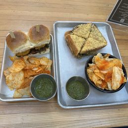 Left: califlower vada pav ( nf ) ( 12 each ) Right: bombay veg panini with masala chips ( nf \ v ) Left: califlower vada pav ( nf ) ( 12 each ) Right: bombay veg panini with masala chips ( nf \ v )