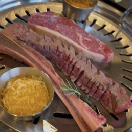 Asado and NY Strip, corn cheese Asado and NY Strip, corn cheese