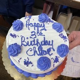 A great chocolate cake with chocolate chip Cannoli filling and whipped cream with right color writing!