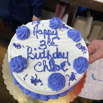 Rudy's Bakery and Cafe - A great chocolate cake with chocolate chip Cannoli filling and whipped cream with right color writing! - Bakeries Near Me - Ridgewood, New York