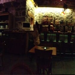 Le Green Café - Very warm interior with a great stone wall behind the bar
