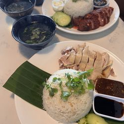Hainanese chicken over rice and bbq honey pork