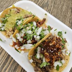 Mi Rancho Market - Carnitas with creamy mild green salsa, Adobado in the middle with no salsa needed, and Asasda with hot chile, which it needed.